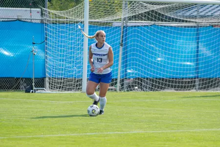 Boise State soccer player Morgan Stone dribbles the ball up the field.