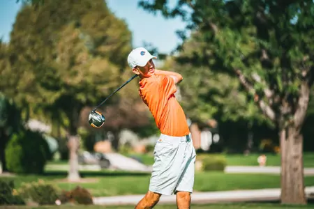 Cole Rueck tracks his tee shot.