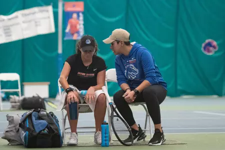 Joana Baptista and Maria Lopez have a discussion during a match.