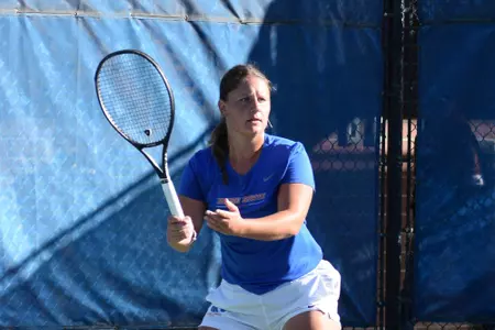 Holly Stewart awaits a serve.