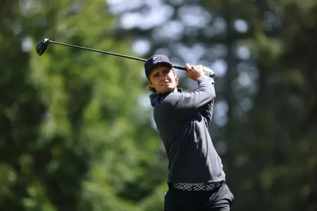 Hugo Townsend follows through on his tee shot.