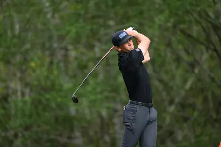 Max Charles on his follow through during a tee shot.