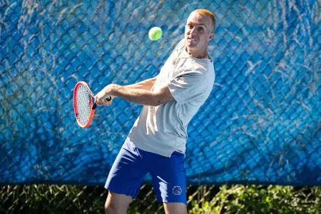 Liam Toroman returns a volley at Dar Walters Classic.