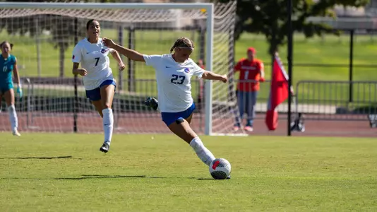 Kenzie MacMillan takes shot in a match.