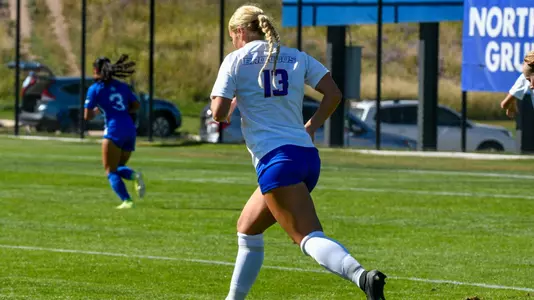 Morgan Stone running on the pitch.