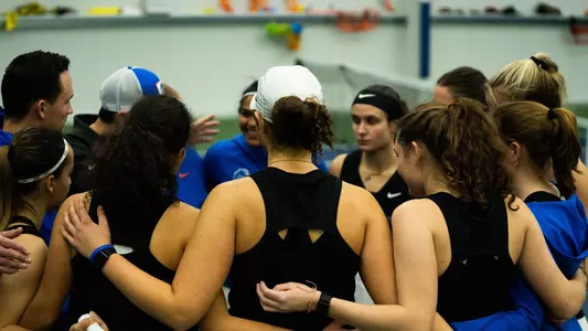 The Boise State women's tennis team huddled together.