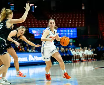 Mya Hansen dribbling against College of Idaho
