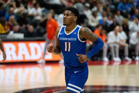 Chibuzo Agbo action shot from match against Virginia Tech, 2023.