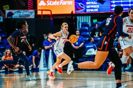 Mary Kay Naro dribbling the ball up the floor