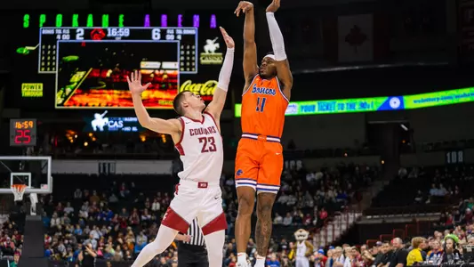 Chibuzo Agbo attempts a 3-pointer vs. Washington State