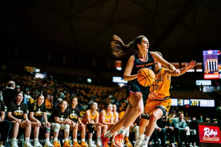 Natalie Pasco drives to the basket in the game against Wyoming