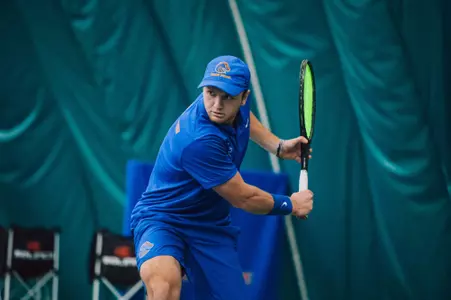 Caden Moortgat playing at No. 5 singles in the win over Idaho State, 1-28-2023