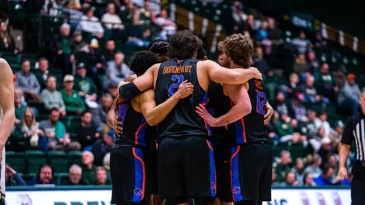 A group of Boise State players huddle together in a game at Colorado State on Feb. 15, 2023