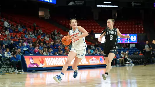 Natalie Pasco attempts a fast break layup against Utah State (2-18-23)