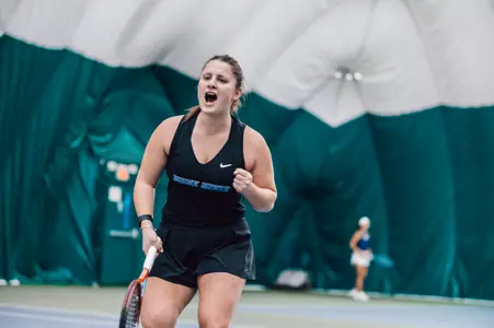 Holly Stewart celebrates a point against Washington, Feb. 3, 2023