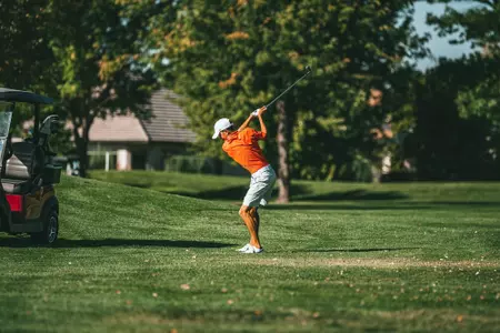 Cole Rueck takes a swing from the fairway during practice at Spurwing Golf Club.