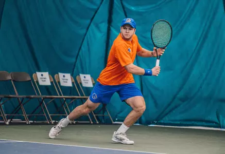 Caden Moortgat waits to return a volley against Idaho on Feb. 10