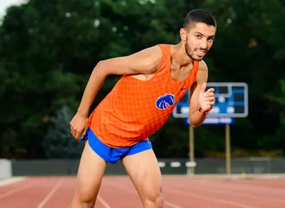 Mohammed Jouhari poses on Ed Jacoby track at Dona Larsen Park for media day photos in 2022.