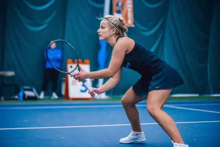 Boise State women's tennis player Pauline Ernstberger awaits a serve.