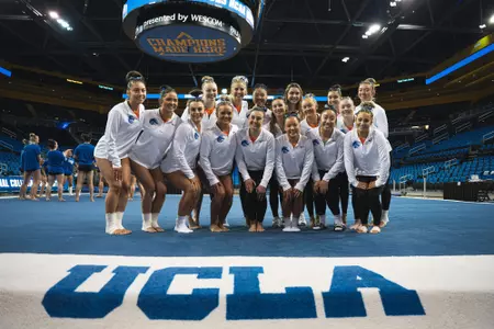 The Boise State gymnastics team poses for a picture at the NCAA Regional Championships Meet