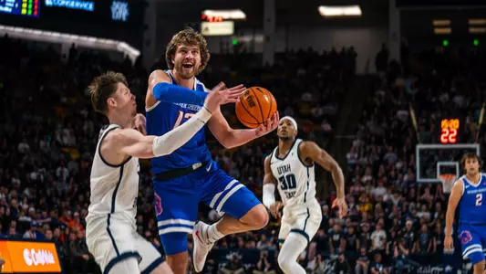 Max Rice drives to the basket past a Utah State defender on the road against the Aggies on March 4, 2023.