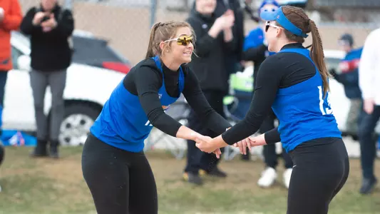 Joey Benson and Aris Vetter celebrate following a point at the Boise State Beach Classic.