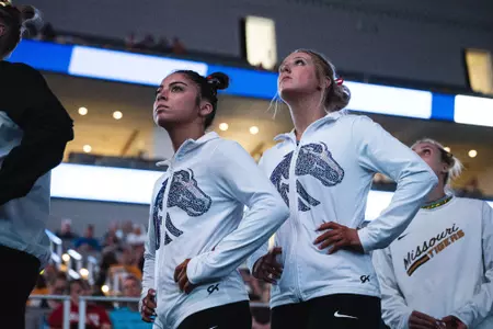 Courtney Blackson and Emily Lopez look up at the videoboard at NCAA Nationals