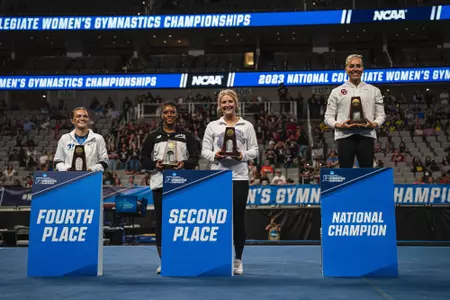Courtney Blackson takes podium pictures at the NCAA Championships after being named the national runner-up on vault