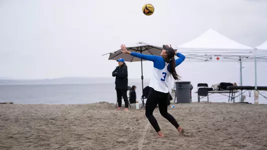 Emilia Guerra-Acuna serves the ball.