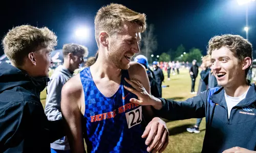 Freddie Carcas and teammates celebrating after setting PR at the Bryan Clay Invitational