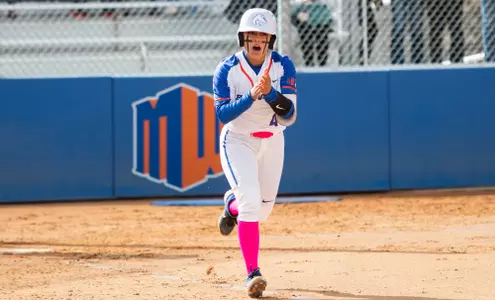 Eliyah Flores cheers as she heads to first base after a walk against Colorado State, March 25, 2023.