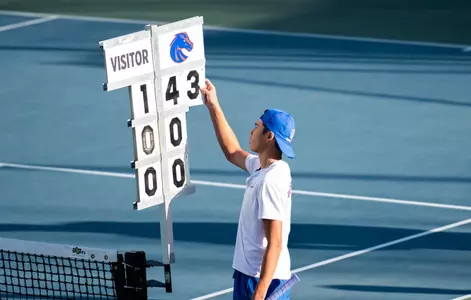 James Van Herzeele adjusts his match score against George Fox on March 18th.