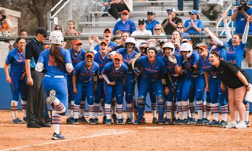 Boise State softball cheering as Ashlyn Whalen runs to home plate after hitting a home run against Idaho State, April 2023.