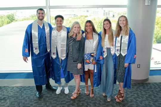 Sara Whiles with student-athletes that graduated this year (2023).