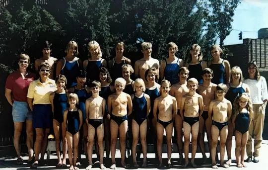 Stephanie Donaldson (bottom row, far right in pigtails) at swim practice as a kid.