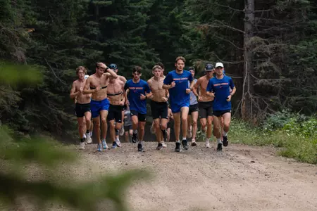 The men's cross country team running at their camp in Cascade, Idaho.