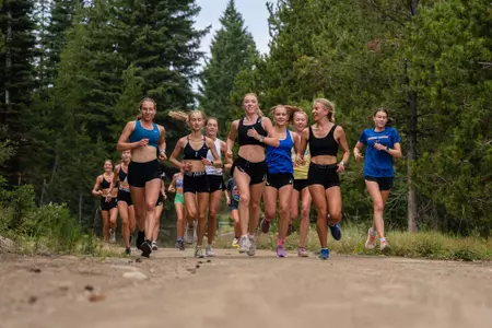 The women's cross country team running at their camp in Cascade, Idaho.