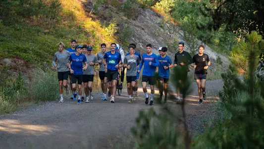 The men's cross country team running during their team camp in Cascade, Idaho