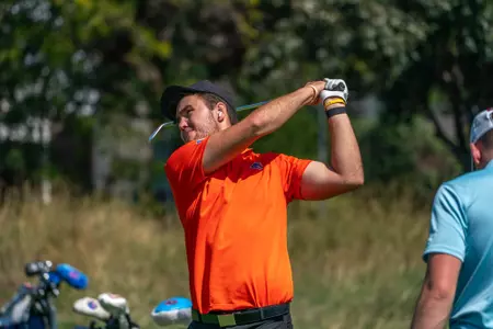 Drew Reinke practices at the driving range in Boise.