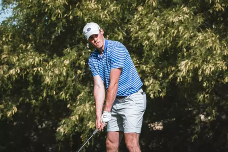Will O'Connor tees up his drive shot during the Mountain West Championships.