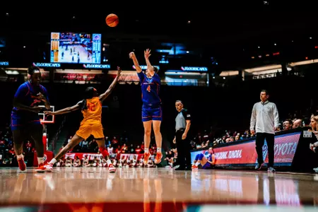 Dani Bayes shoots a 3-pointer against New Mexico