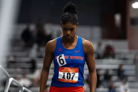 Janiah Brown looking down and walking.