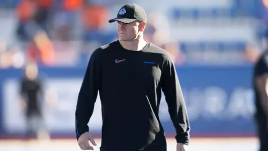 Spencer Danielson watches his players pregame prior to No. 21 Boise State's game against Utah State.