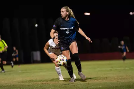 Avery McBride dribbling the ball.