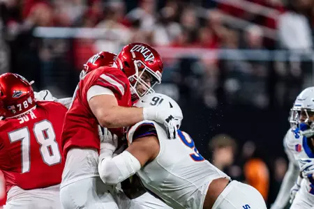 Ahmed Hassanein pressures the quarterback during No.17 Boise State's 29-24 victory over UNLV on Oct. 25, 2024. Photo by Kenna Harbison.