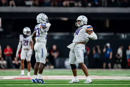 Seyi Oladipo and Ahmed Hassanein celebrate during No.17 Boise State's 29-24 victory over UNLV on Oct. 25, 2024. Photo by Kenna Harbison.