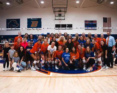 Group photo of alums on Alumnae Day in Bronco Gym on October 5, 2024.