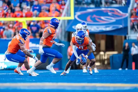 Ty Benefield returns a fumble as No. 21 Boise State defeated Utah State 62-30 in the conference opener at Albertsons Stadium on Oct. 5, 2024. (Photo by Kenna Harbison).