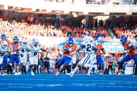 Jambres Dubar rushes the ball as No. 21 Boise State defeated Utah State 62-30 in the conference opener at Albertsons Stadium on Oct. 5, 2024. (Photo by Kenna Harbison).
