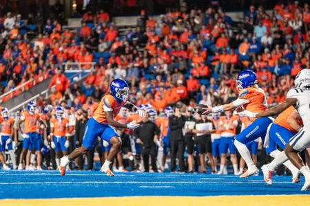 Jambres Dubar takes a handoff as No. 21 Boise State defeated Utah State 62-30 in the conference opener at Albertsons Stadium on Oct. 5, 2024. (Photo by Kenna Harbison).